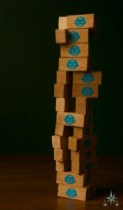 a stack of wooden blocks with blue faces